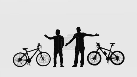 Foto de Black silhouettes of two male cyclists communicating on a white isolated background. Man pointing direction with his finger, contemplating and admires the surroundings. Travelers bicyclists standing - Imagen libre de derechos
