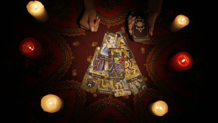 Photo for Fortune teller session scene. Close up shot of a woman model hands holding a deck and making a fan layout with tarot cards for client. Esoteric concept. - Royalty Free Image
