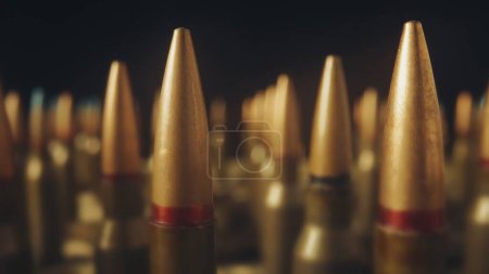 Photo for Endless rows cartridges for a rifle on a black background close up. Defocused background. The concept of firearms, shooting range, production and trade of ammunition - Royalty Free Image