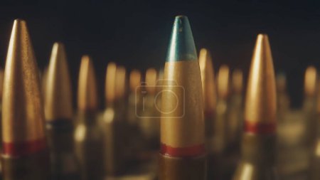 Photo for Endless rows cartridges for a rifle on a black background close up. Defocused background. The concept of firearms, shooting range, production and trade of ammunition - Royalty Free Image