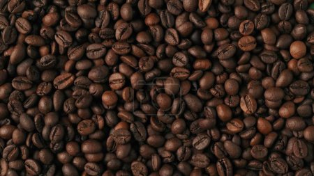 Photo for Closeup shot of aromatic roasted coffee beans background. Advertising area, template. Space to insert advertisement object. Creative abstract concept. - Royalty Free Image