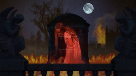 Photo for Graveyard, cemetery catched on fire. Ghost stands in the center of the frame. Statues on the sides, huge tombstone, gravestone. Halloween, spooky season. Clip for your advertisement or creative - Royalty Free Image