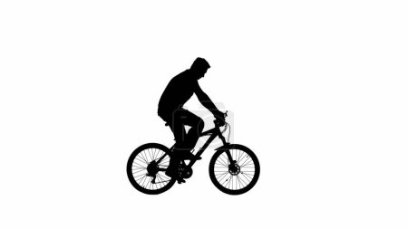Foto de Bicicleta silueta concepto creativo. Silueta negra del hombre que monta una bicicleta deportiva aislada en el canal alfa de fondo blanco. Retrato de ciclista masculino en una bicicleta moviéndose pedales, mirando a su alrededor. - Imagen libre de derechos