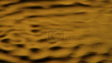 Photo for Water and liquids creative abstract advertisement concept. Close up shot of surface texture. Beautiful golden light water surface with circles and waves, abstract background, wallpaper template. - Royalty Free Image