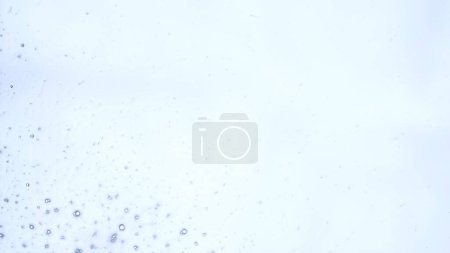 Photo for Water and liquids creative abstract advertisement concept. Close up shot of surface texture. Blown foam soap bubbles on clear transparent white surface, abstract background, wallpaper template. - Royalty Free Image