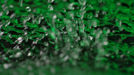 Photo for Water and light creative abstract advertisement concept. Close up shot of surface texture. Beautiful green vivid water surface with splashes from falling drops, abstract background, wallpaper template - Royalty Free Image