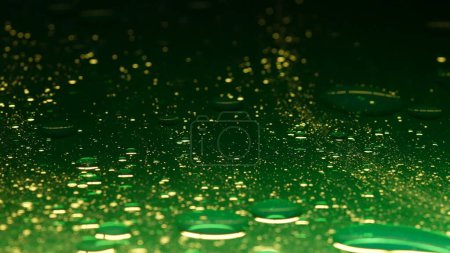 Photo for Water and different liquid creative advertisement concept. Close up studio shot of water texture. Green ink colored water surface with oil drops texture mixing, abstract wallpaper background. - Royalty Free Image