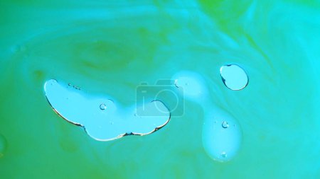 Photo for Water and different liquid creative advertisement concept. Close up studio shot of aqua texture. Natural green colored water surface with blurred oil droplets floating, abstract wallpaper background. - Royalty Free Image