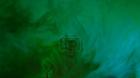 Photo for Water and liquid mixing creative abstract concept. Close up studio shot of aqua surface. Deep green colored water with ink and oil drops matte beautiful texture, abstract background wallpaper. - Royalty Free Image
