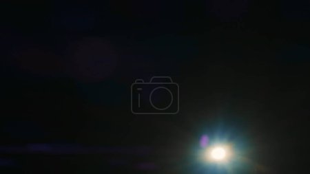 Photo for Cinematic lights reflections. Lens flare flashes effects on black background. Anamorphic lens flares advertisement template creative concept. Abstract overlay with bright white spot light. - Royalty Free Image