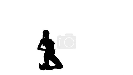 Photo for Modern dance style creative advertisement concept. Portrait of female dancer. Silhouette of attractive woman dancer in high heels posing on knees at camera, isolated on white background alpha channel. - Royalty Free Image