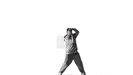 Photo for On white background as if drawn with cartouche and style x effect. Man in clothes with street style. Demonstrates dance movement, posing. He is plastic, rhythmic. Covering his face with his hands. - Royalty Free Image