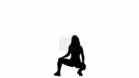 Photo for In the picture on a white background sits on the kittens a slim girl in a silhouette. Demonstrates dance movement in the twerk style. It s sexy, plastic. Its facing the camera. Its a medium frame. - Royalty Free Image