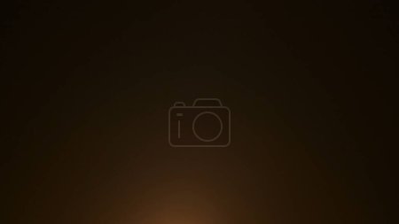 Photo for The frame shows an abstract on a black background, isolated. One edge of the frame is illuminated by fire, light. Creating a smooth transition, a gradient. Used for screensavers, backgrounds. Macro. - Royalty Free Image
