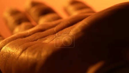 Photo for Detailed drawing of palm skin. Human closeup medicine skin. Healthy naked surface. Orange light. - Royalty Free Image