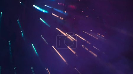 Photo for In the shot on a purple, dark background bright light that breaks through the smoke, clouded background. Represents an abstract screensaver or a picture, a patern for something. - Royalty Free Image