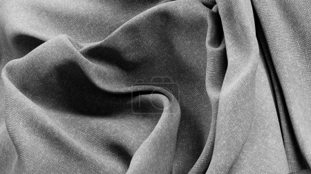 Foto de Esta imagen presenta una tela de lino gris elegantemente cubierta, que muestra la textura natural y sutil y las líneas fluidas del material de alta calidad. La interacción de luz y sombra a través de las telas - Imagen libre de derechos