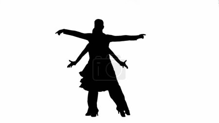 Téléchargez les photos : Cette image saisissante capture la silhouette d'un couple de danseurs de salon dans une pose dynamique, mettant en valeur l'élégance et la passion de la danse. L'homme et la femme sont représentés à mi-chemin de la danse, leur corps - en image libre de droit