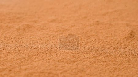 Photo for Aromatic spices creative advertisement concept. Close up studio shot of spice. Background of brown dried cinnamon powder with fractions. - Royalty Free Image