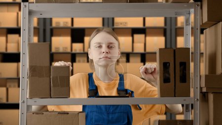 Photo for Business warehouse and logistics creative advertising concept. Portrait of a female working in a warehouse. Uniformed warehouse girl - Royalty Free Image