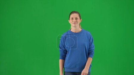 Photo for Portrait of an attractive woman leading an active lifestyle on a green screen close up. A woman during a walk - Royalty Free Image