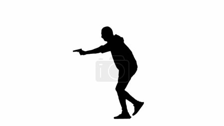 Foto de Silueta negra de ladrón sobre fondo blanco aislado. Hombre ladrón con capucha y pasamontañas caminando con un arma en las manos, preparándose para cometer un crimen. Vista lateral - Imagen libre de derechos