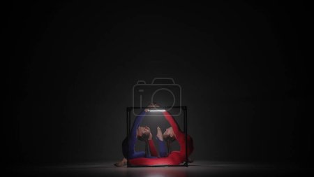 Photo for Modern choreography and acrobatics creative advertisement concept. Portrait of two female acrobats isolated on black background. Girls aerial dancers in blue red suits demonstrating pose inside cube. - Royalty Free Image