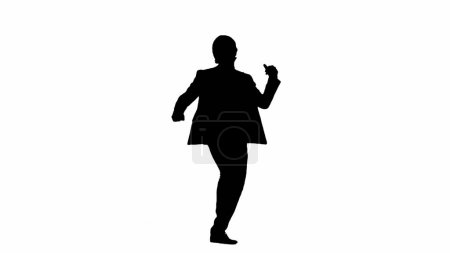 Foto de Moderno concepto publicitario de hombre de negocios. Hombre en estudio aislado sobre fondo blanco con canal alfa. Una silueta negra de un hombre de negocios en un traje baila divertido - Imagen libre de derechos