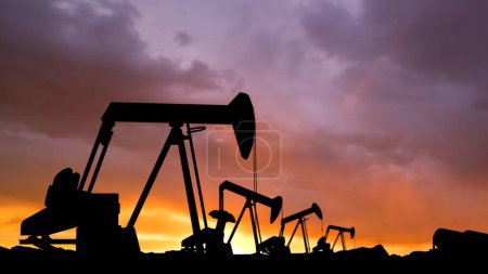 Photo for Modern methods of power industry technology creative advertisement concept. Shot of oilfield heads against sunset sky. Many drilling rig units towers extracting crude oil from the soil. - Royalty Free Image