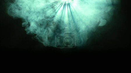 Photo for Professional stage equipment and lightning creative advertisement concept. Studio shot of projector haze isolated on black background. Green light rays shining from above with smoke moving around. - Royalty Free Image