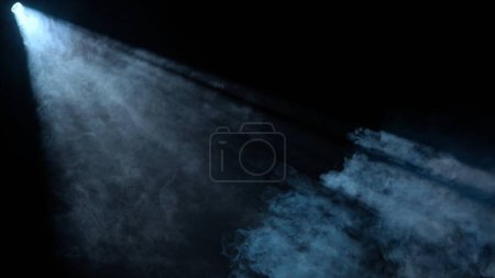 Photo for Professional stage equipment and lightning creative advertisement concept. Studio shot of projector haze effect isolated on black background. White colored bright rays shining diagonally with smoke. - Royalty Free Image
