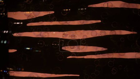 Photo for Soap bubbles on a black background with pink stripes. - Royalty Free Image