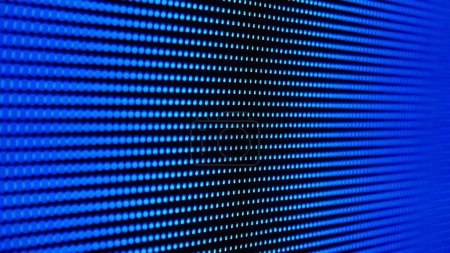 Foto de Esta imagen muestra una vista de cerca de un panel de luz led brillante con una rejilla de píxeles iluminados, creando una textura moderna y tecnológica. - Imagen libre de derechos