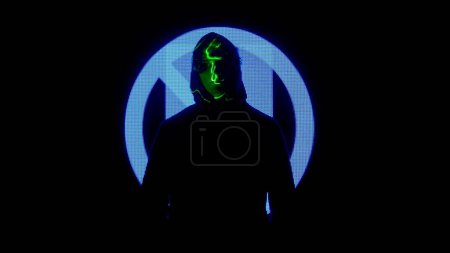 Photo for Digital visual technology concept. Male against big digital wall. Man in hoodie silhouette in front of digital screen wall with neon symbols in dark club, laser projection on body. - Royalty Free Image