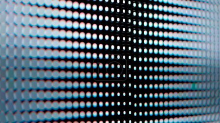 Une macro prise de vue d'un panneau LED numérique. L'image met en évidence les pixels RVB individuels disposés dans une grille. Clignotement de l'écran et problèmes épileptiques.
