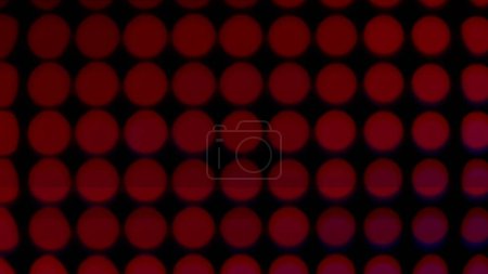 Makroaufnahme eines digitalen LED-Panels. Das Bild hebt die einzelnen RGB-Pixel hervor, die in einem Raster angeordnet sind. Blinkende Bildschirme und epileptische Störungen.