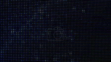 Une macro capture les points RVB vibrants d'un écran LED numérique. L'image présente les pixels individuels qui créent collectivement des affichages visuels haute définition.