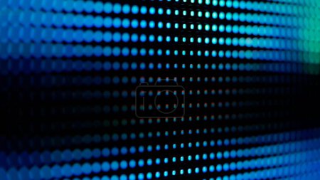 Eine detaillierte Nahaufnahme eines digitalen LED-Panels. Das Bild hebt die einzelnen RGB-Pixel hervor, die in einem Raster angeordnet sind, und veranschaulicht die komplexe Technologie hinter elektronischen Displays.