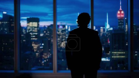 Photo for Corporate business advertisement concept. Successful business man in the office. Man ceo hedge fund top manager in front of window with evening city view standing looking outside. - Royalty Free Image
