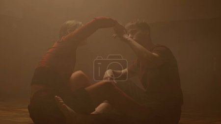 Photo for Experimental choreography dance style concept. Professional dancers performing dance show. Young man and woman contemporary dancers perform modern choreography elements on the floor in old hall. - Royalty Free Image