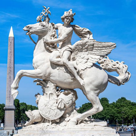 Photo for Tuileries Garde. Sculpture of the god Mercury mounted on the horse Pegasus.  Made of Carrara marble by Antoine de Coysevox. In the background, the obelisk on the Place de la Concorde. The statue in the Tuileries garden is a copy; the original is in t - Royalty Free Image