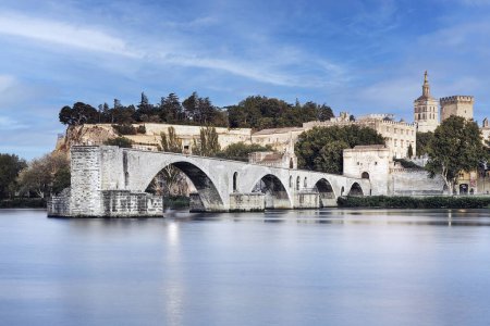 Photo for The Pont Saint-Benezet, also known as the Pont d'Avignon, was a medieval bridge spanning the Rhone river in the city of Avignon. Department of Vaucluse. France. Only four arches remain. - Royalty Free Image