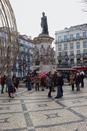 Photo for Lisbon, Portugal - December 23, 2019: Camoes Monument in the Camoes Square of Lisbon, Portugal. Luis de Camoes is the national poet. The smaller figures on the statue were leading figures in Portuguese culture and literature in the Age of Discoveries - Royalty Free Image