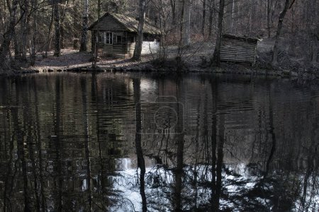 Photo for Cabin next to a small lake in the Palatinate Forest of Germany on a winter afternoon. - Royalty Free Image