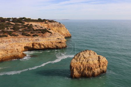 Overlooking rock and cliff in Atlantic Ocean on a winter day on the Seven Hanging Valleys Trail in southern Portugal.