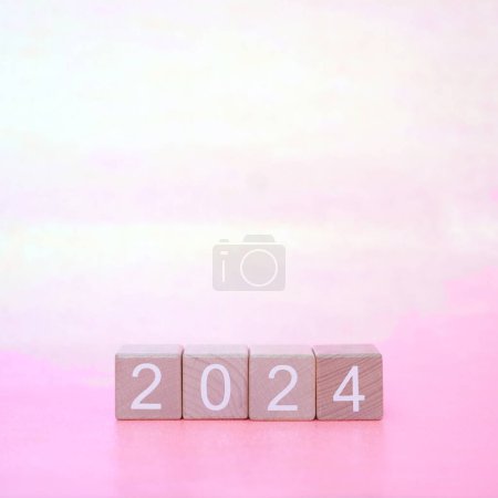 Photo for 2024 wooden blocks on pink background - Royalty Free Image