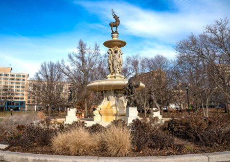 Photo for Hartford, CT - USA - Dec 28, 2022 The two-tiered Corning Fountain, a bronze and granite fountain with stylized Saukiog and Oneida Indians and a stag located in Bushnell Park located in  Hartford. - Royalty Free Image