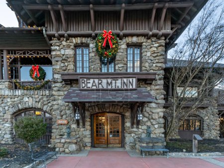 Photo for Bear Mountain, NY - US - Dec 30, 2023 The holiday decorated entrance to the Rustic park lodge; the Bear Mountain Inn. Located in New York States  Bear Mountain State Park - Royalty Free Image