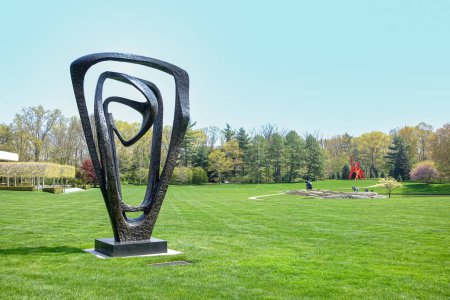 Photo for Purchase, NY  US  Apr 28, 2024 Barbara Hepworths Meridian, a triangular sculpture of bronze loops on the Donald M Kendall Sculpture Gardens at the PepsiCo World headquarters in Purchase - Royalty Free Image