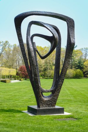 Photo for Purchase, NY  US  Apr 28, 2024 Barbara Hepworths Meridian, a triangular sculpture of bronze loops on the Donald M Kendall Sculpture Gardens at the PepsiCo World headquarters in Purchase - Royalty Free Image